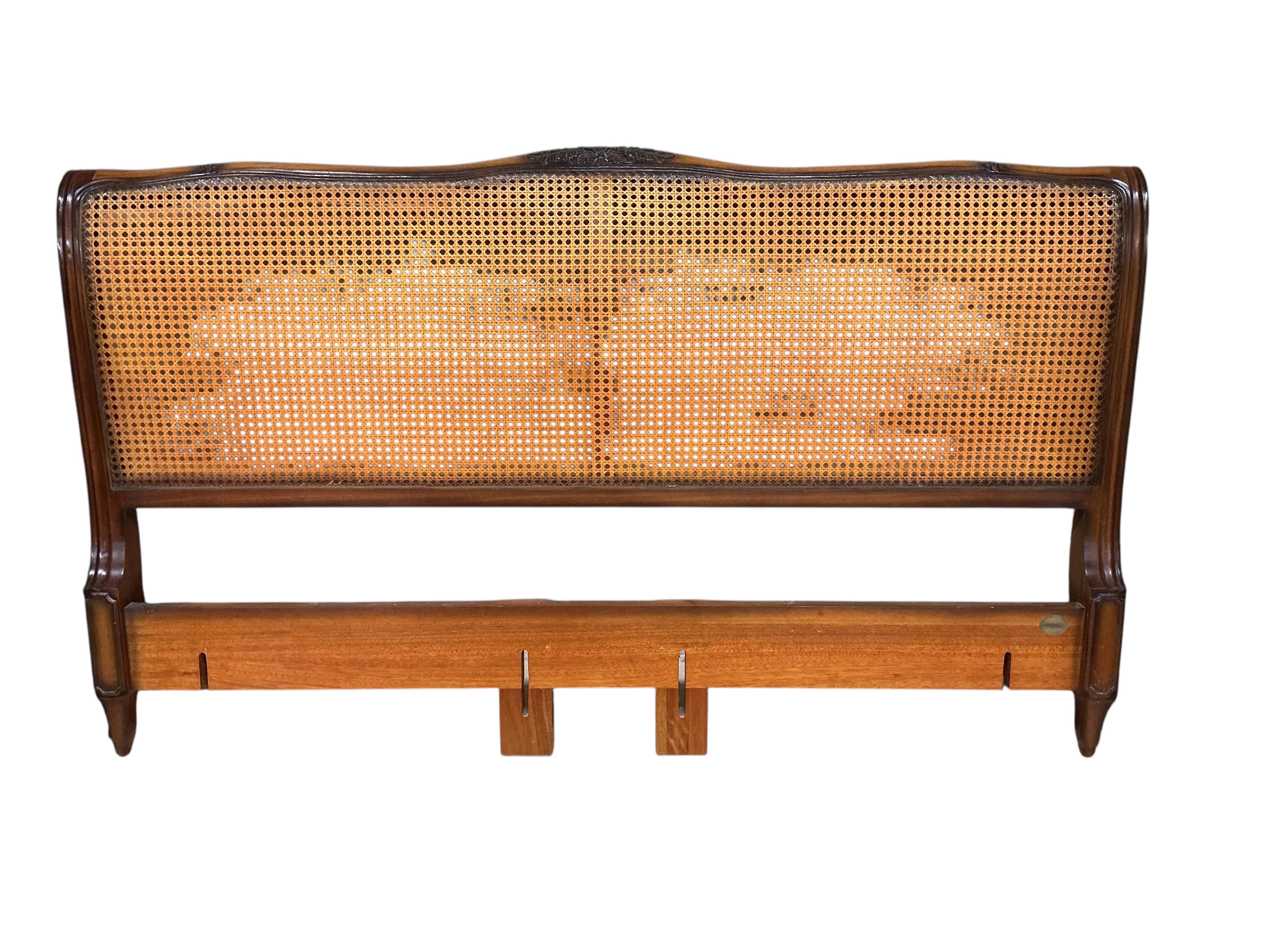 A reproduction caned walnut headboard, width 194cm